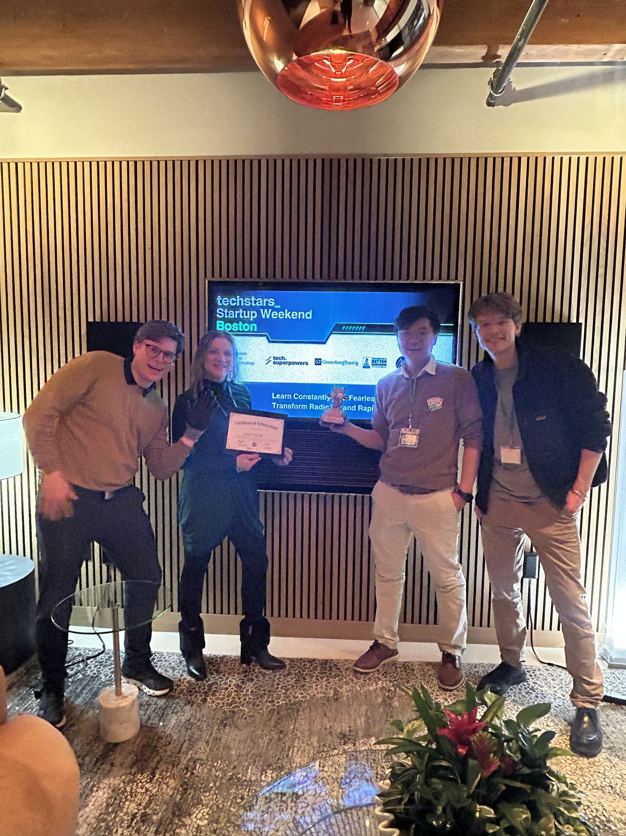 CaniBrush team holding 1st place award at Boston TechStars 2026 Startup Weekend